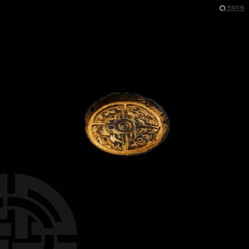 Anglo-Saxon Gilt Chip-Carved Saucer Brooch with Hidden Faces