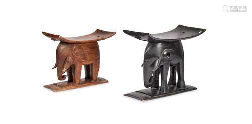 An ebonised tribal elephant stool and another similar carved...