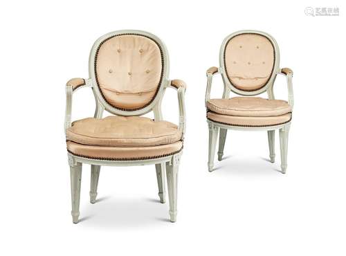 A pair of Louis XV style grey and white painted fauteuils