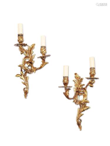 A pair of Louis XV style gilt bronze twin-light wall lights