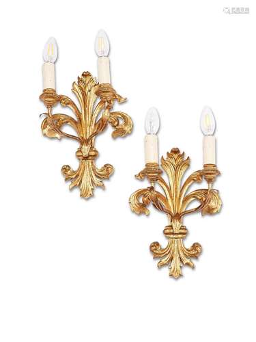 A pair of Italian carved giltwood fleur-de-lys twin-light wa...