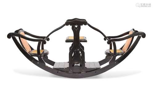 A late Victorian ebonised and caned three-seater child'...