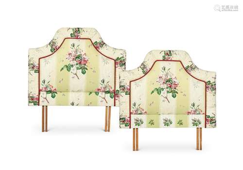 A pair of floral upholstered single bed heads