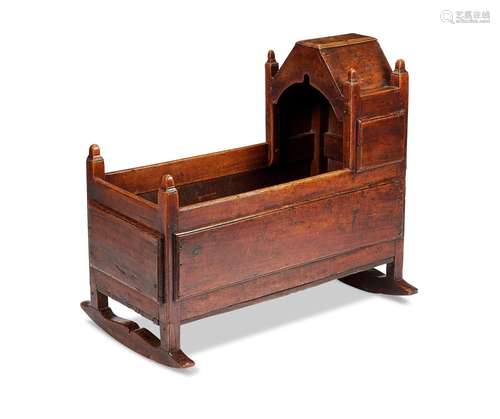 A late 17th / early 18th century cherrywood and oak cradle