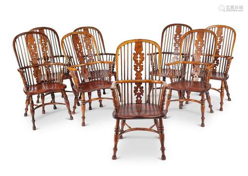 A set of eight late 19th/early 20th century yew-wood windsor...