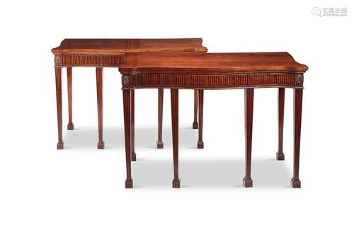 A pair of Chippendale style carved mahogany serpentine servi...