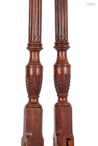 A set of George III mahogany carved bed posts