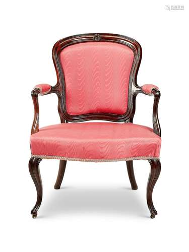 A George III carved mahogany open armchair