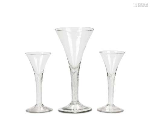 A pair of 18th century air twist wine glasses and another la...