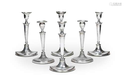 A set of four late 18th century Sheffield plate candlesticks...