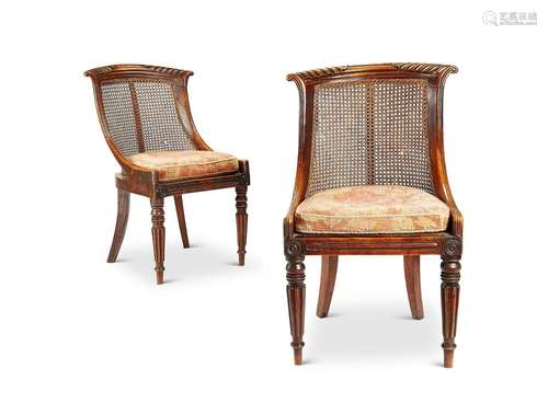 A pair of Regency simulated rosewood bergère side chairs