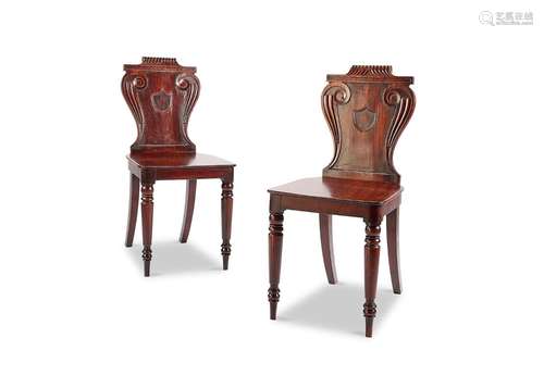 A pair of Regency mahogany hall chairs