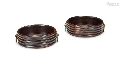 A pair of Regency mahogany wine coasters