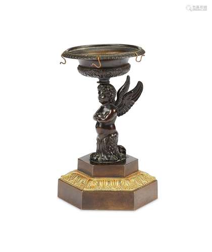 A Regency patinated bronze ring stand