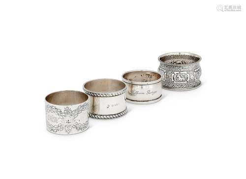 Four various silver napkin rings