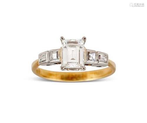 An emerald cut diamond solitaire ring