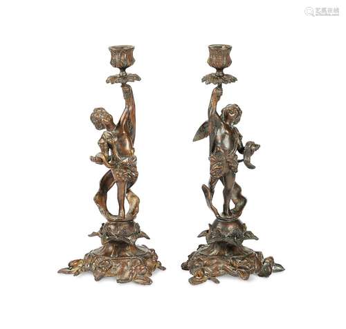 A pair of late 19th century French bronze candlesticks by F....