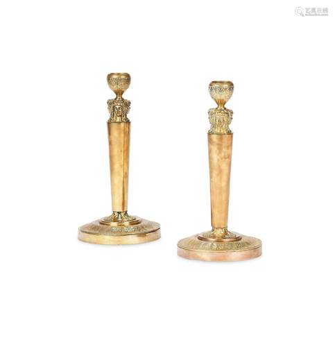 A pair of 19th century French Empire ormolu candlesticks