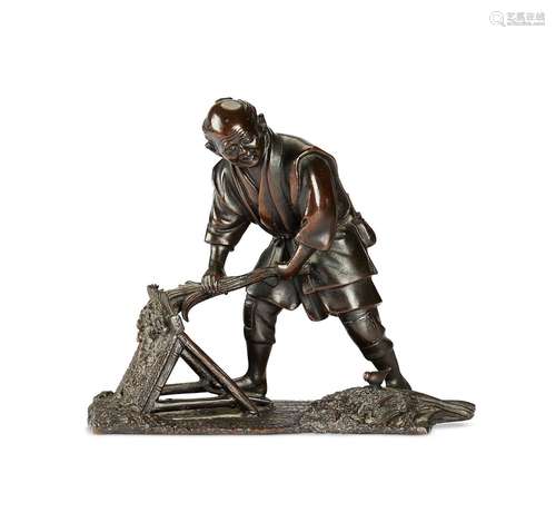 A Meiji period Japanese patinated bronze of a farmer threshi...