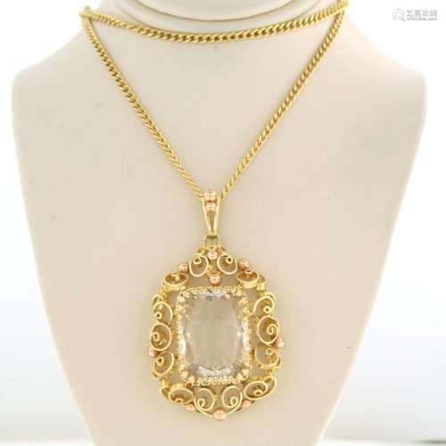 14K yellow gold necklace with pendant set with a rock crysta...