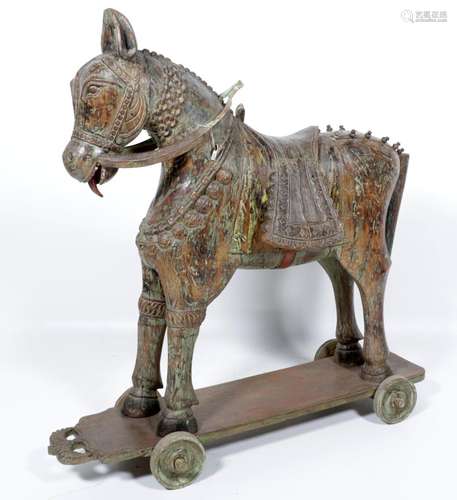 Old polychrome teak horse resting on wheels, h.158 x w.43 x ...