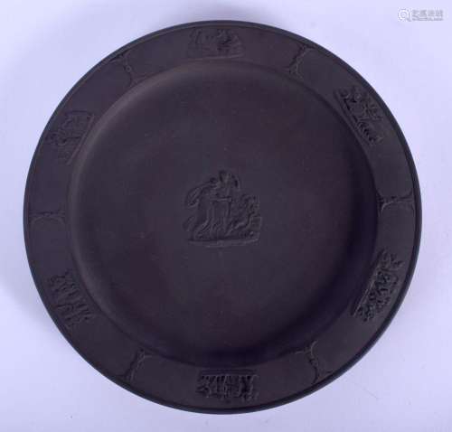 A WEDGWOOD BLACK BASALT CIRCULAR PLATE decorated with cupid ...