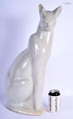A 1950S HEALS POTTERY FIGURE OF A SEATED CAT of elegant form...