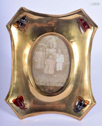 AN ARTS AND CRAFTS BRASS AND AGATE PHOTOGRAPH FRAME inset a ...