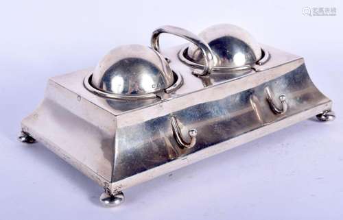 AN EDWARDIAN SILVER RECTANGULAR DESK INK STAND with domed re...