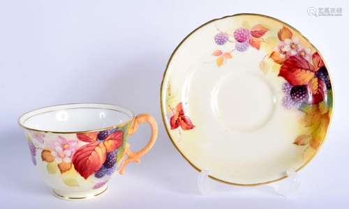 Royal Worcester teacup and saucer painted with autumnal leav...