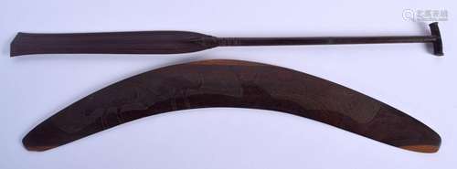 AN AUSTRALIAN TRIBAL PADDLE together with a boomerang. Large...