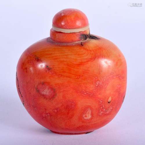 A 19TH CENTURY CHINESE CARVED CORAL SNUFF BOTTLE AND STOPPER...