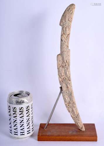 A FINE AND RARE NORTH NATIVE AMERICAN INUIT CARVED BONE SKAT...