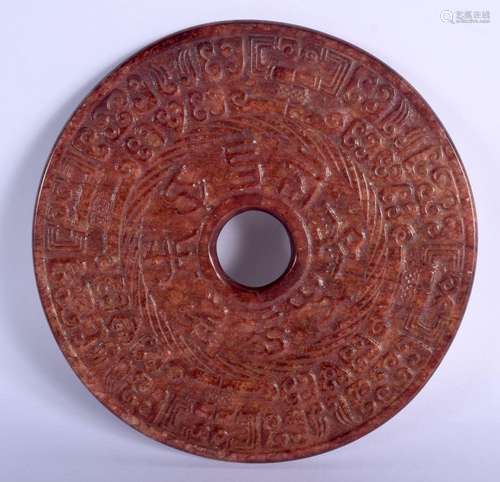 A LARGE CHINESE CARVED BROWN JADE BI DISC. 17 cm diameter.