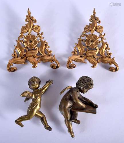 A PAIR OF ANTIQUE BRONZE PUTTI and two gilt metal mounts. (4...