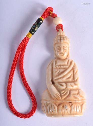 AN ORIENTAL CARVED BONE BUDDHA PENDANT. 16 grams. 6 cm x 3.2...