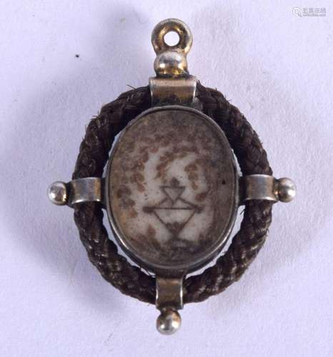 AN ANTIQUE HAIR PENDANT. 2.25 cm x 1.75 cm.