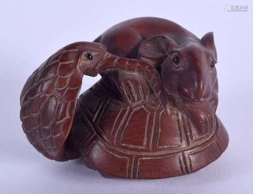 A JAPANESE RAT WOOD NETSUKE. 3 cm x 8 cm.