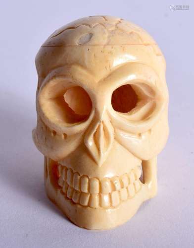 A JAPANESE CARVED BONE SKULL NETSUKE. 24 grams. 4.5 cm x 3 c...