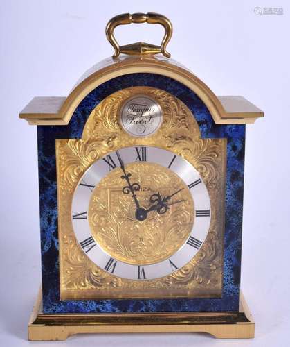 A SWIZA BRASS MANTEL CLOCK. 17 cm x 11 cm.