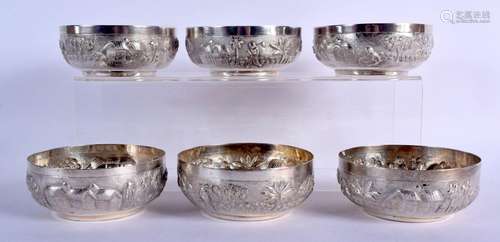 SIX ANTIQUE INDIAN WHITE METAL BOWLS decorated with landscap...