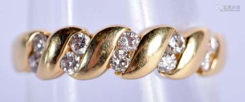 AN 18CT GOLD AND DIAMOND RING. 2.7 grams. O/P.