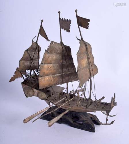 AN ANTIQUE CHINESE SILVER BOAT. 165 grams inc stand. 18 cm x...