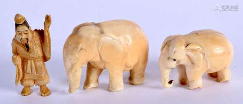 TWO ANTIQUE IVORY ELEPHANTS together with a similar man. 38 ...