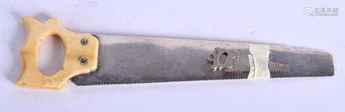 AN ANTIQUE CONTINENTAL SILVER AND IVORY SAW. 26 grams. 15 cm...