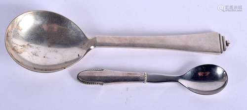 TWO GEORG JENSEN SILVER SPOONS. 93 grams. Largest 18 cm long...