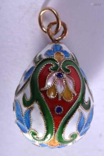 A CONTINENTAL SILVER GILT AND ENAMEL EASTER EGG PENDANT. 9 g...