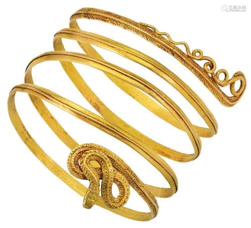 A sprung coiled bangle, of serpent design, unmarked, interna...