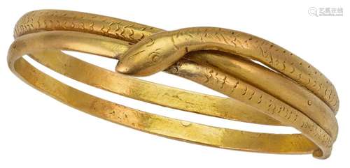 A double row bangle of serpent design, with engraved scale d...