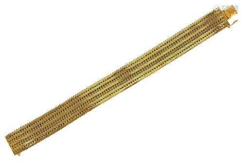 An 18ct gold flexible bracelet, of chevron linking, London i...